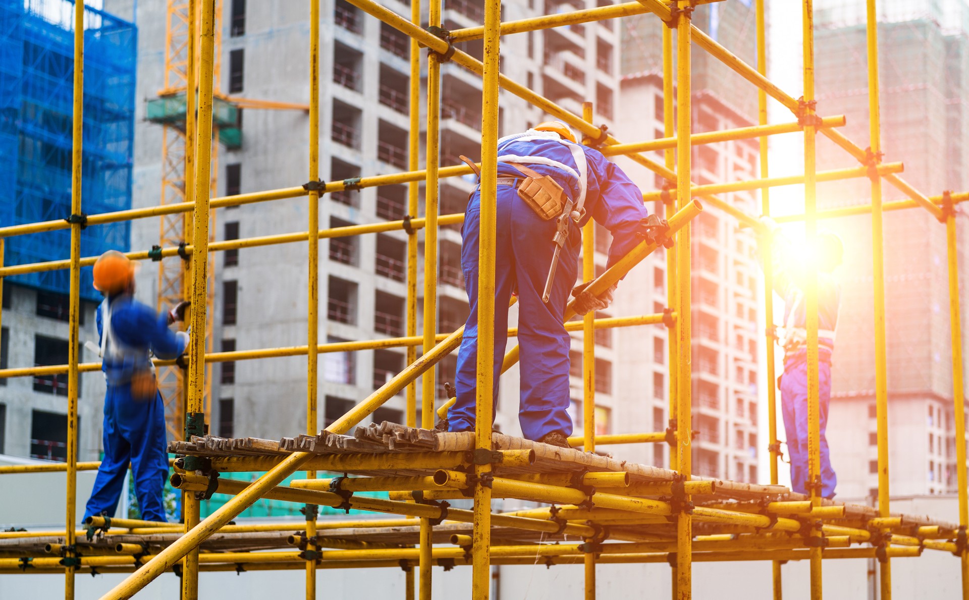 Construction workers working on scaffolding